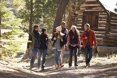 group-walking-by-cabin